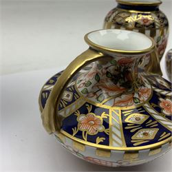 Pair of Royal Crown Derby 6299 imari miniature two-handled vases, together with another miniature vase of baluster form, all with printed mark beneath, tallest H8cm 