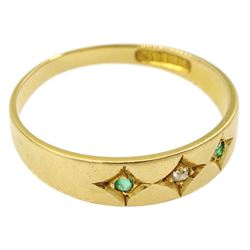 Early 20th century gold three stone gypsy set emerald and diamond ring, stamped 18ct 