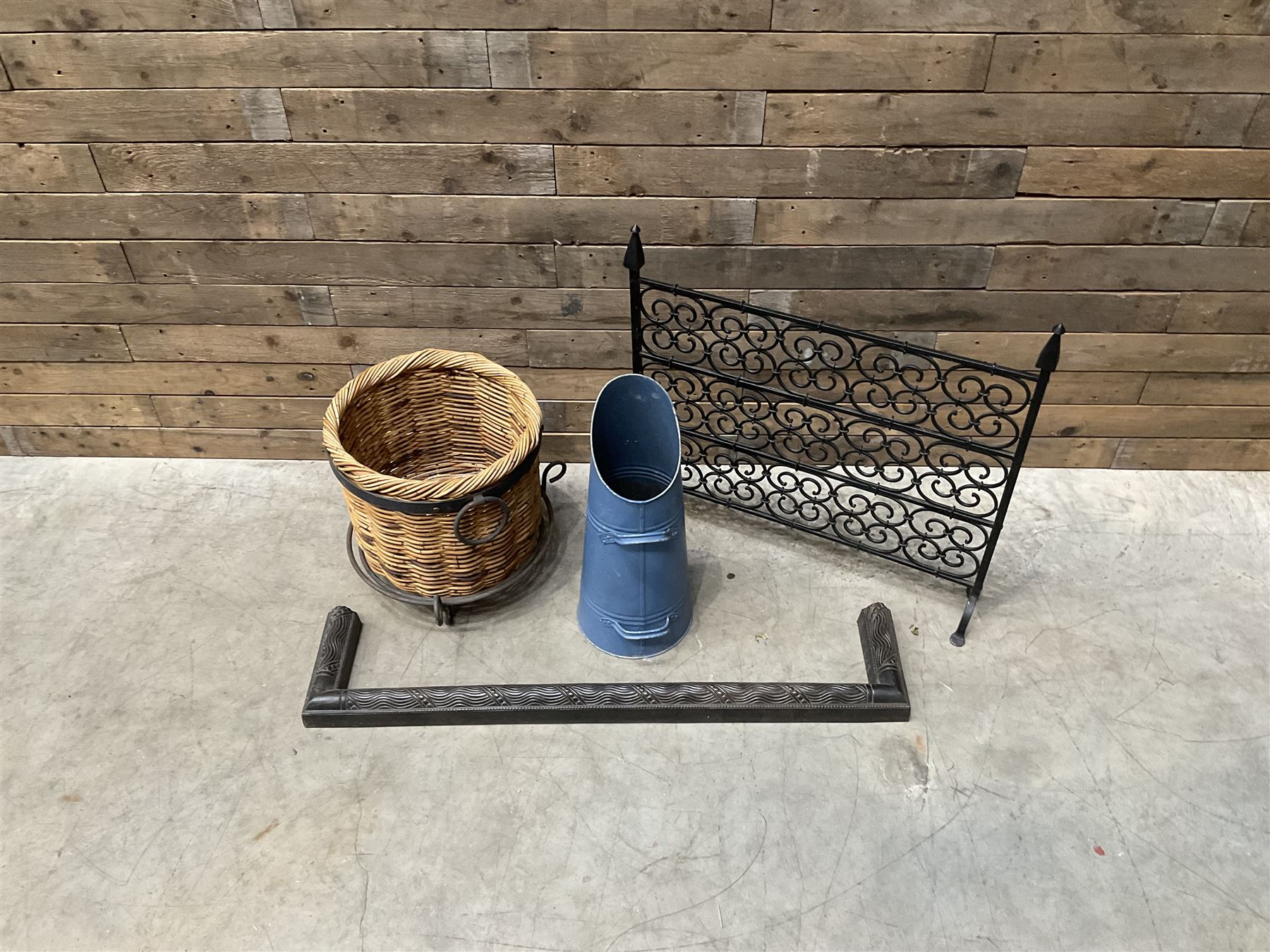 Black painted wrought iron fire guard , wicker log basket with stand, coal bucket and a fire kerb (4)