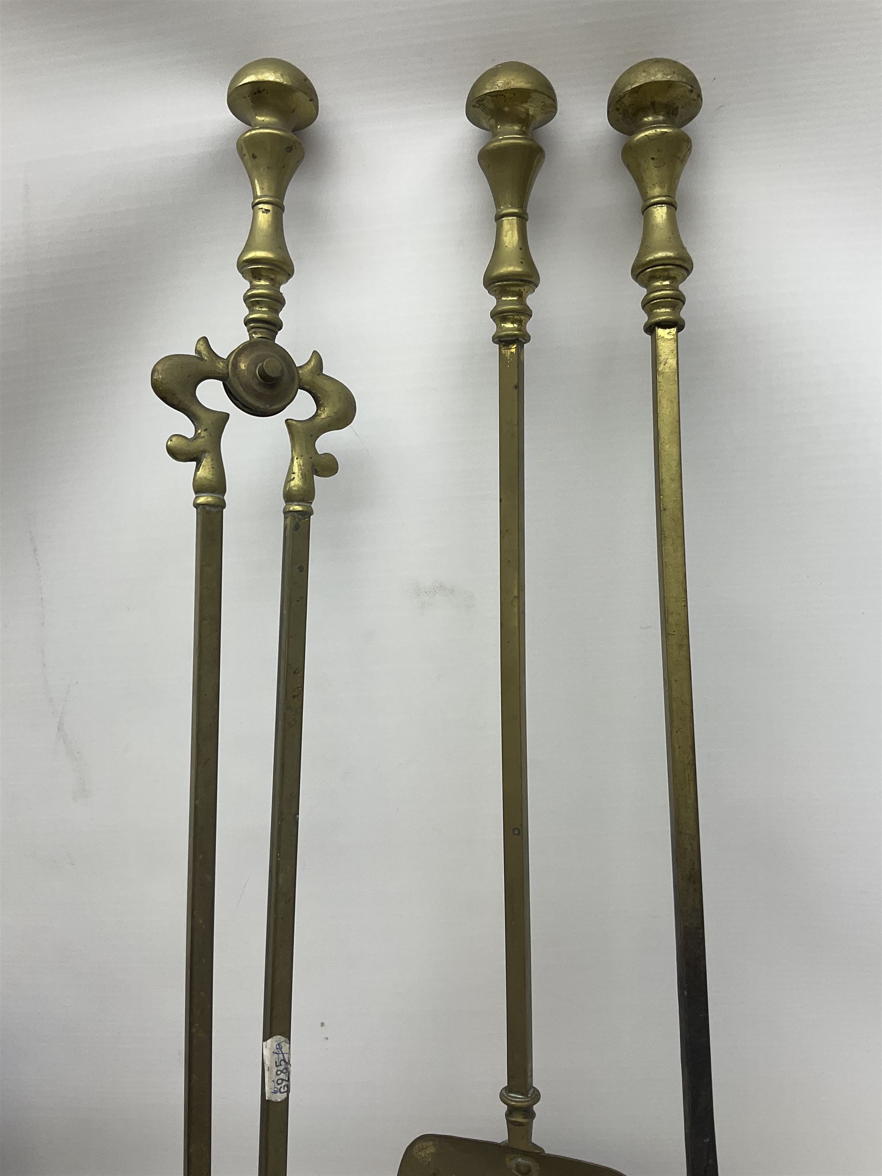 Victorian mahogany coal scuttle, the domed rolling lid carved with ornate foliate motifs opening to reveal interior with twin handled liner, mounted with carrying handle and shovel, together with brass fireside tools, largest H46cm