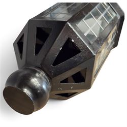 Georgian design black-painted metal octagonal hanging lantern, with brass ball finial above a hipped canopy, astragal glazed lattice panels and pendant ball terminal