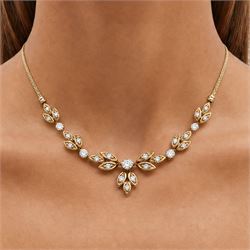 18ct gold diamond floral design necklace, five round brilliant cut diamonds, each spaced by leaf design links set with diamonds, to a Spiga link chain, Sheffield import mark 1989, total diamond weight approx 0.75 carat