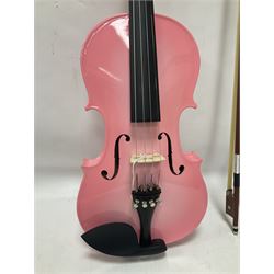 Zest full size pink violin, with a solid wood body and maple head, with matching pink bow and two further bows, in a hard case Length 60cm