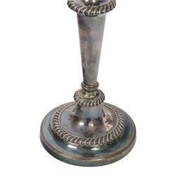 Pair of silver plated three branch candelabra, each with three urn-shaped sconces, with scroll arms, tapering stem upon a circular base, together with silver plated wine flagon