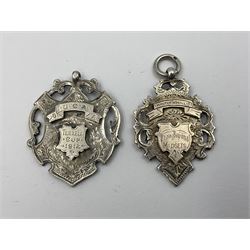 Seven Edwardian and later silver cartouche fobs, to include five gold faced examples and three double sided examples, all hallmarked with various dates and makers
