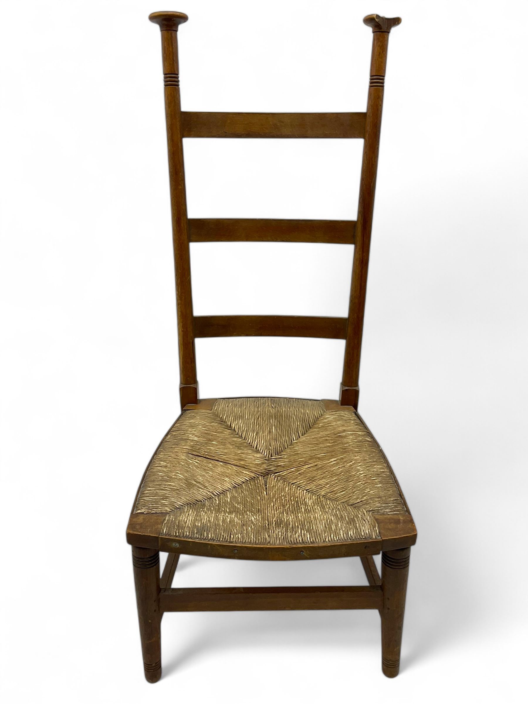 Attributed to William Birch of High Wycombe - Arts & Crafts oak ladder-back side chair, with turned finials, rush seat, and stretchers, raised on square-section supports; 19th century mahogany Pembroke table, rectangular drop-leaf top raised on turned supports with central stretcher and splayed feet