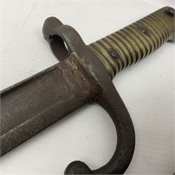 WWI Remington Pattern 1913 bayonet, the 43cm fullered blade with various marks to the ricasso including date code 11 16; in leather covered scabbard with various stamps including JWB 17 L58cm overall; and a French Model 1866 sabre bayonet (no scabbard)