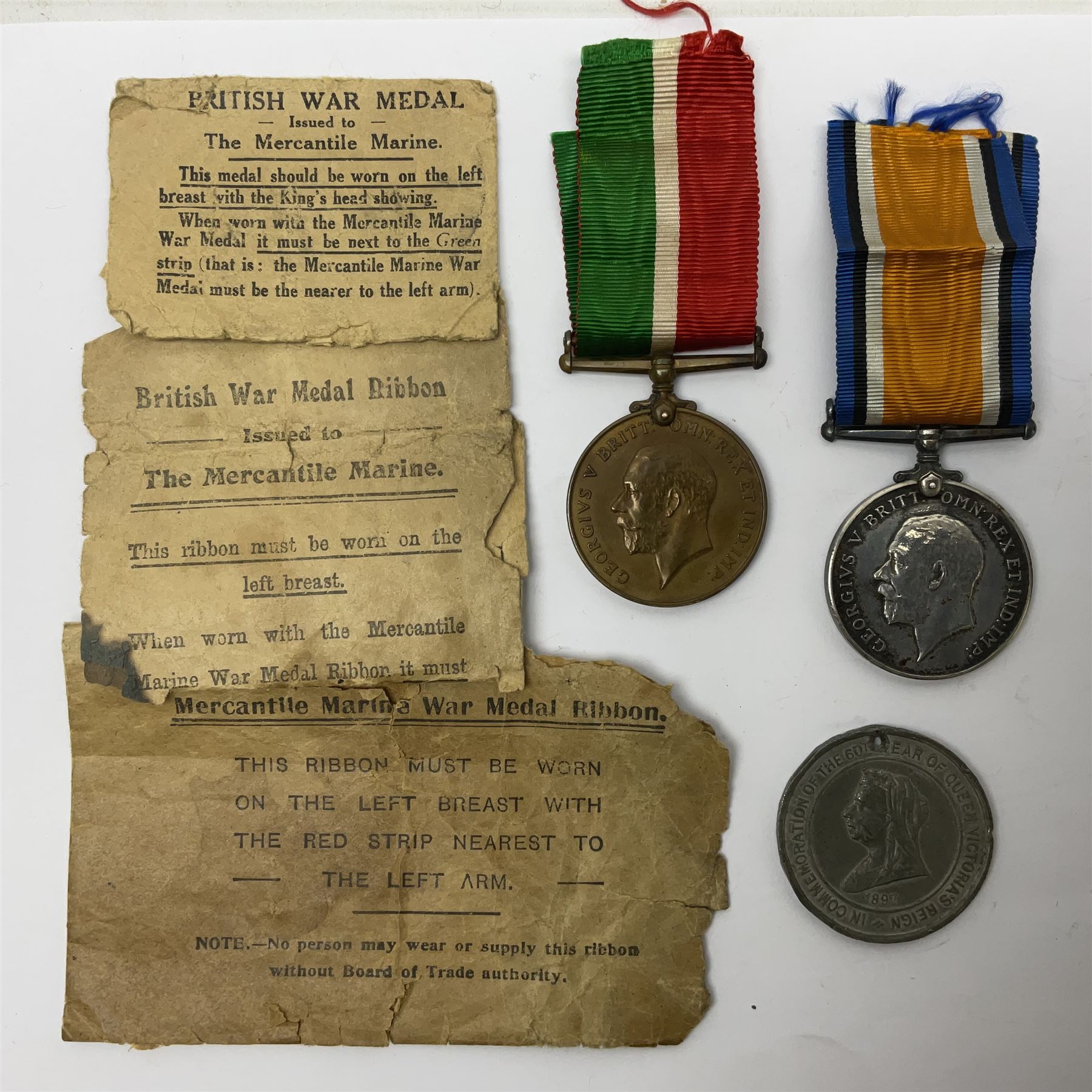 WWI pair of medals comprising Mercantile Marine medal and British War medal, awarded to Dominic L Kelly; both with ribbons and part original packaging and a Victoria Diamond Jubilee medallion.