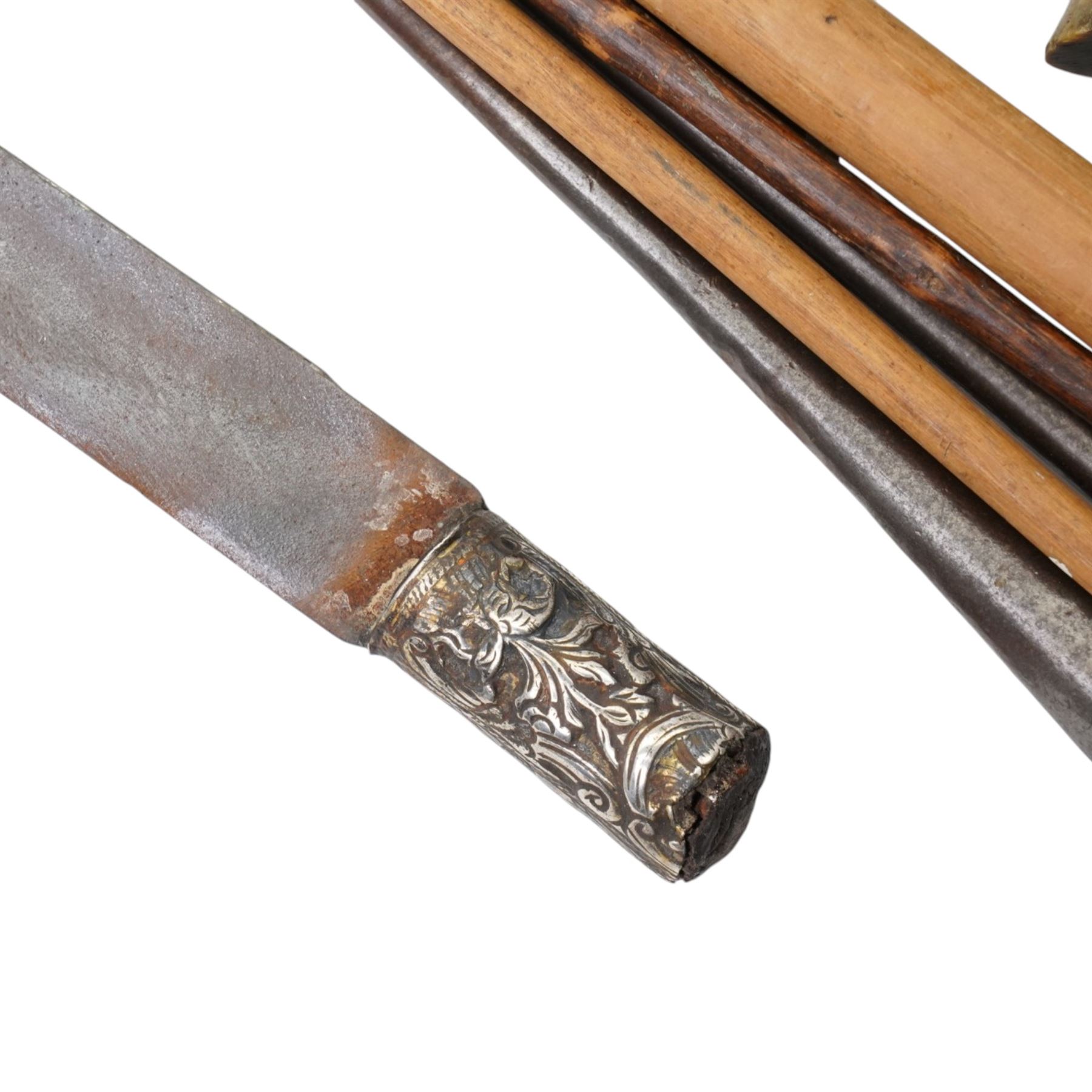 Nepalese kukri with skinning knives in leather scabbard, horse hair and leather sporran by Leckie Graham & Co 1900, Burmese sword, African spears and a military print