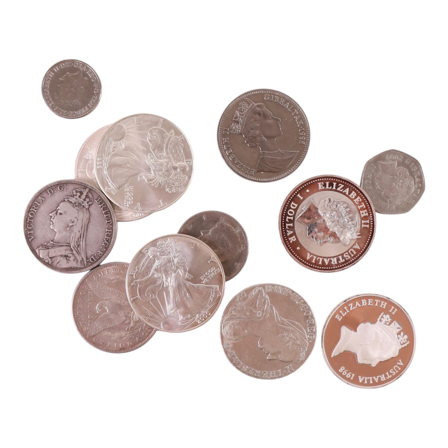 Eight silver coins, comprising two Queen Elizabeth II Australia one ounce fine silver one dollar coins, 1998 'Kangaroo' and 2001 'Kookaburra', three United States of America one ounce fine silver one dollar coins, 1999, 2000, and 2001, United States of America 1889 'Morgan' silver dollar, Queen Victoria 1891 silver crown, and Maria Theresa thaler, and four further coins