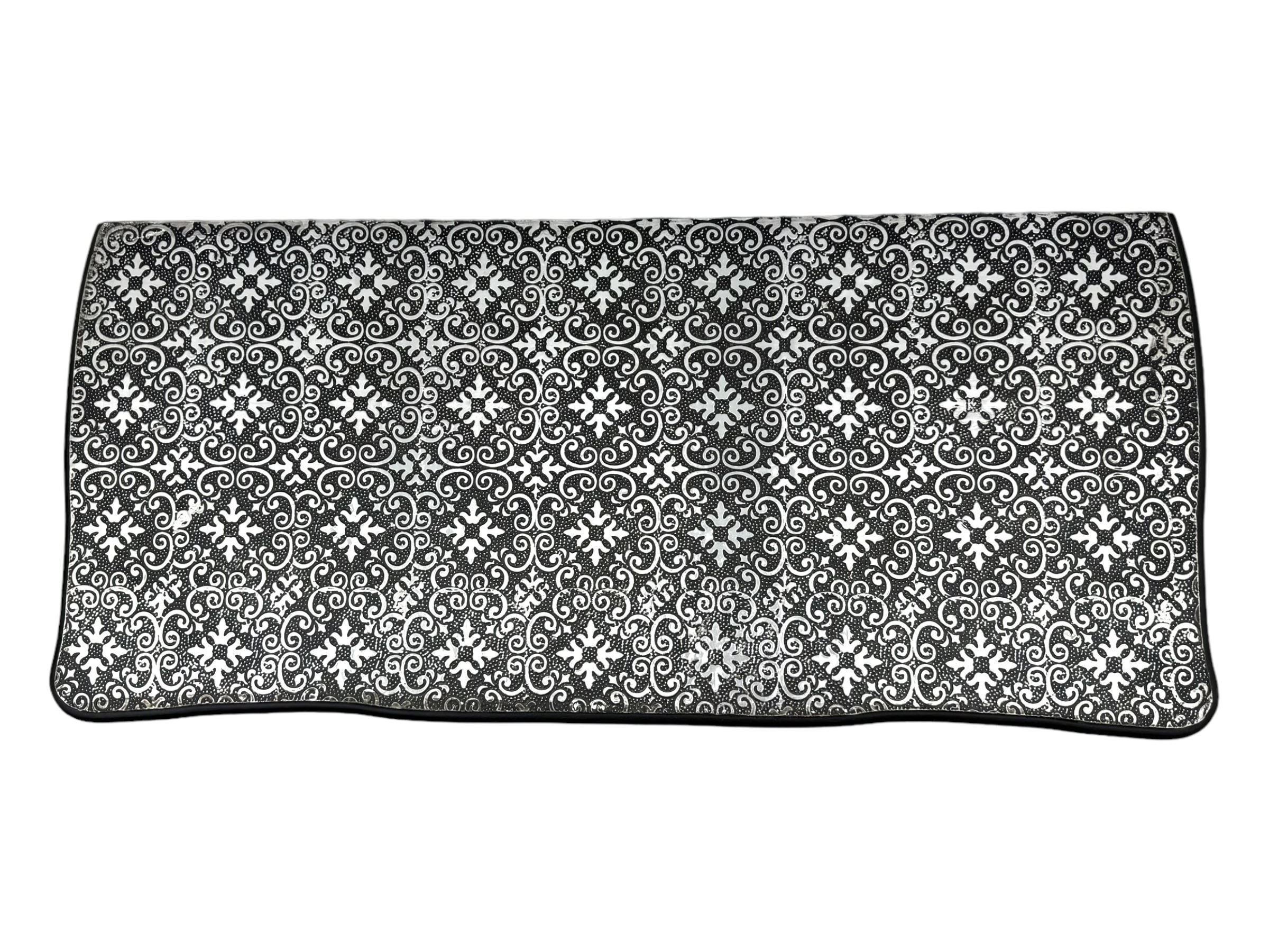 Contemporary black lacquered metal-clad chest, embossed with silver floral scrollwork, shaped rectangular top over three drawers, on cabriole supports (W89cm, D40cm, H79cm); matching two drawer chest (W68cm, D35cm, H67cm)