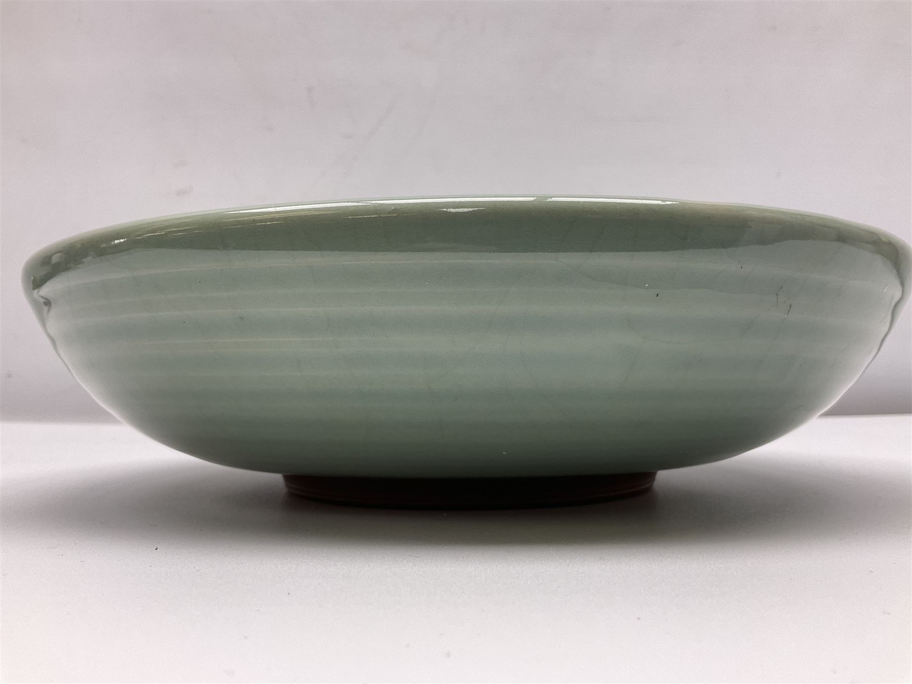 Agnete Hoy (1914-2000): Bullers studio pottery celadon glazed bowl, the interior with incised decoration depicting a Mermaid, D28.5cm