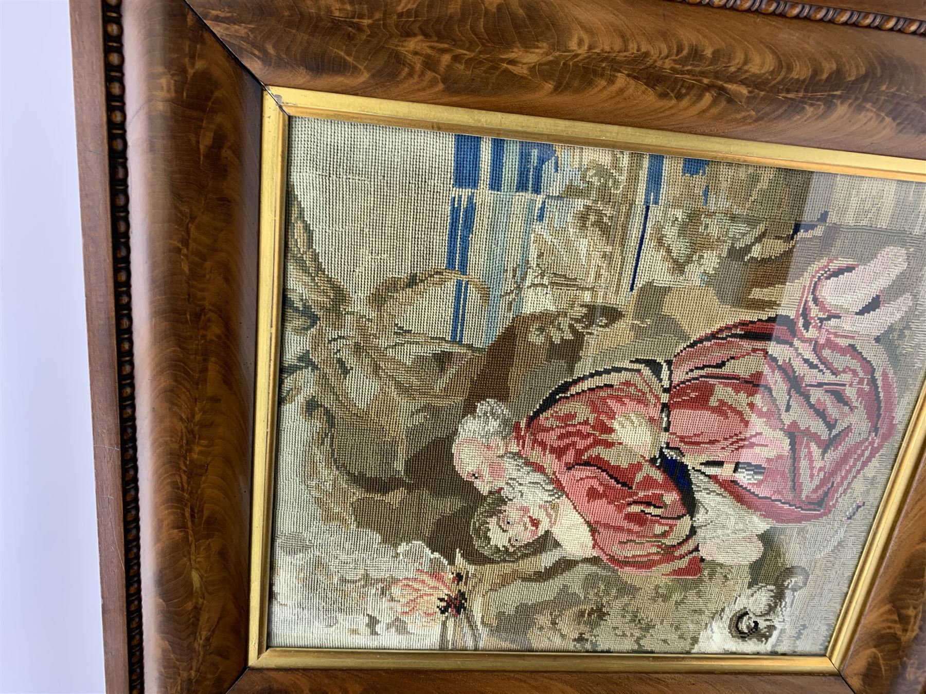 FRAMES - Victorian figured mahogany frame, with egg and dart edging and a gilt slip, containing a Berlin woolwork picture depicting Abraham and Isaac, H78cm W69.5cm