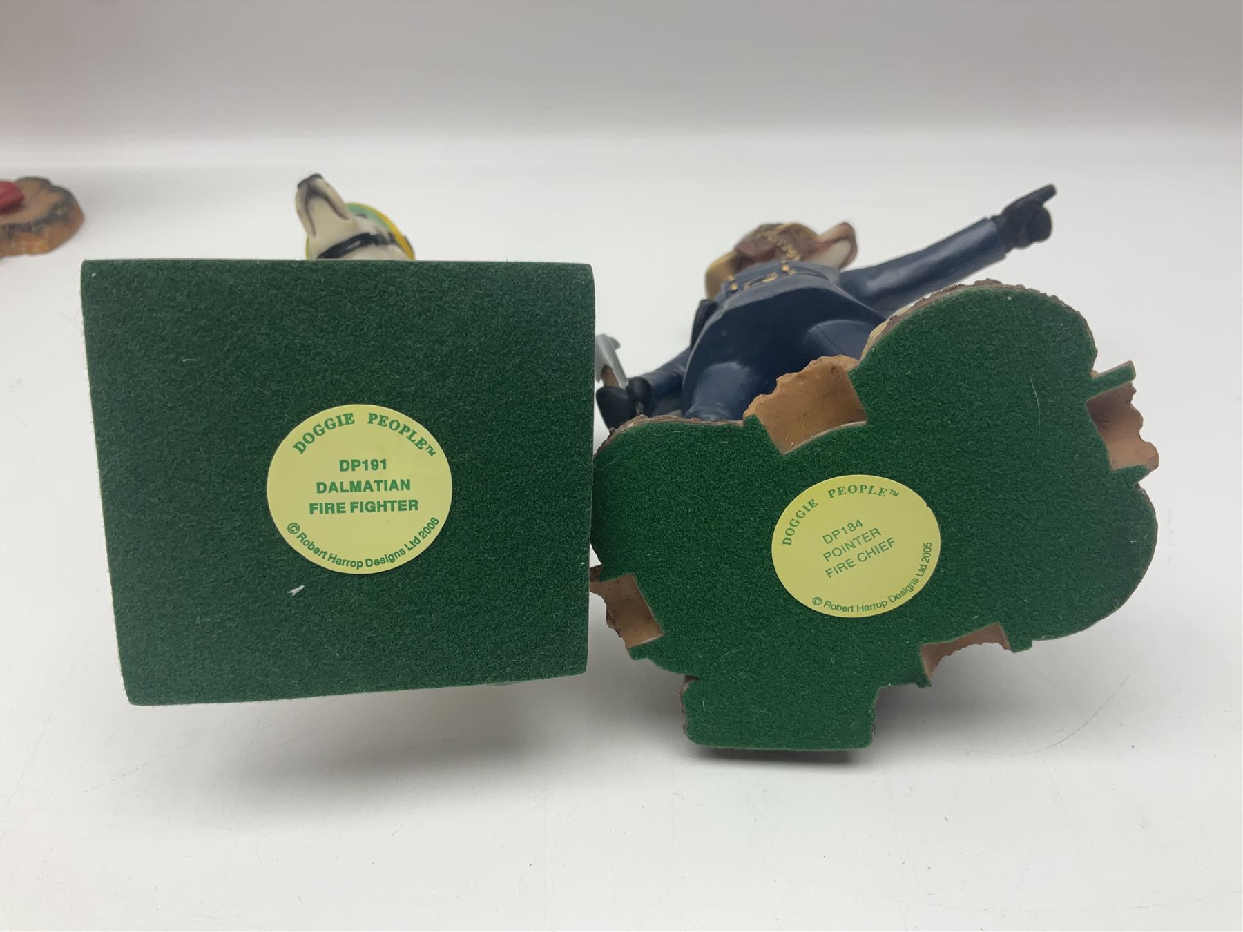 Eleven Robert Harrop figures from various collections, comprising limited edition The Trumpton Fire Engine Musical Box CGMB8 no. 359/1000, The Dragon from the Red Knight BN09, Bulldog Fireman DP165, Pointer Fire Chief DP184, Dalmatian New York Fire Fighter DP234, Dalmatian Fire Fighter DP191; Desperate Dan ‘Fireman Dan’ BDS11, Cuthbert CG13, Pugh (Clarinet) CG70, The Soup Dragon CL05 and Baby Dragon CL06