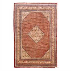 North West Persian Boteh-Mir hand-knotted rug, madder red field decorated with an all-over...