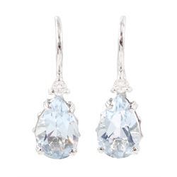 Pair of 18ct white gold aquamarine and diamond drop earrings, each set with a single pear ...