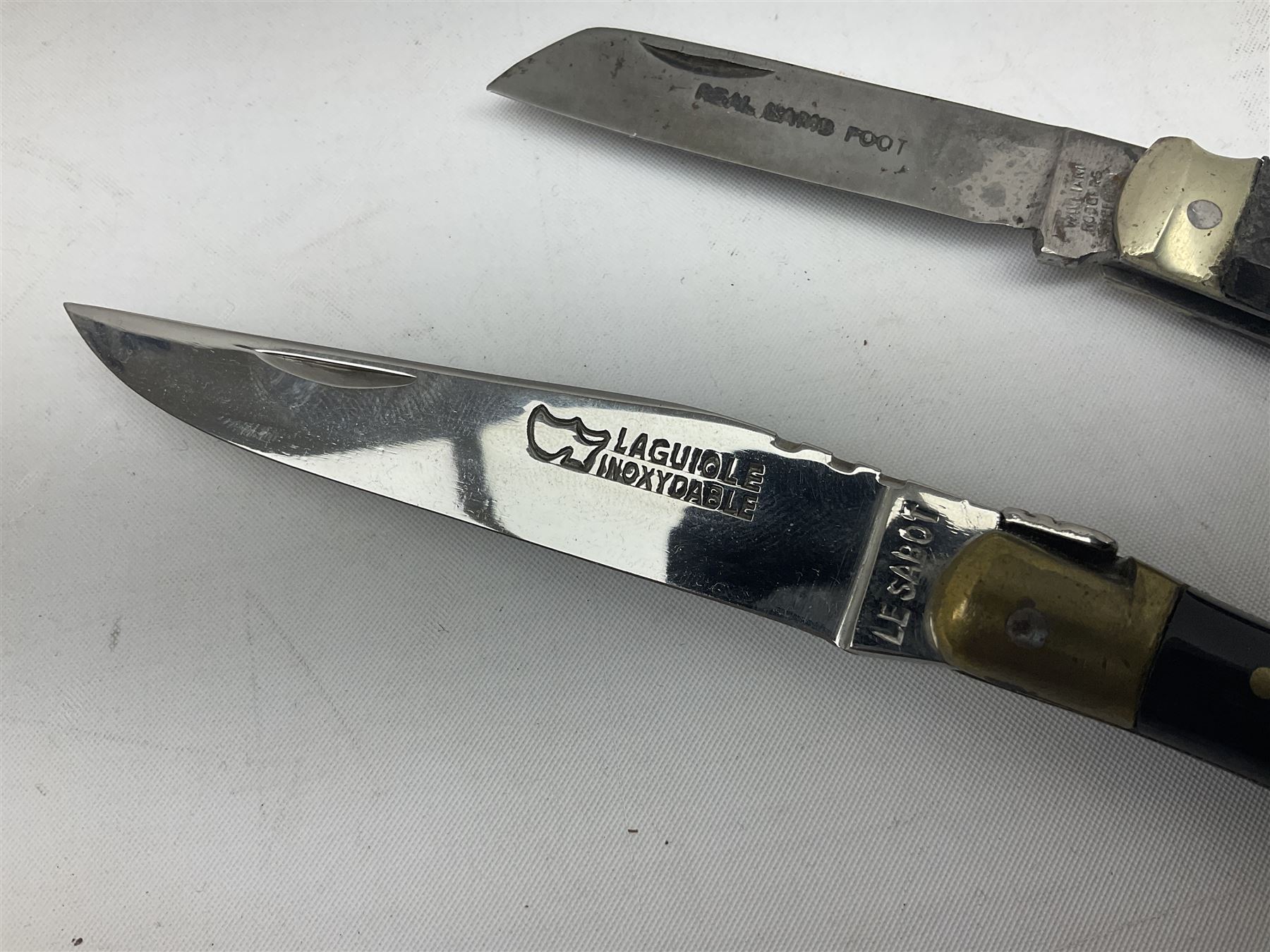 Laguiole pocket knife, with brass mounts and Bee mouche, L19.5cm open, together with a further William Rodgers Sheffield knife