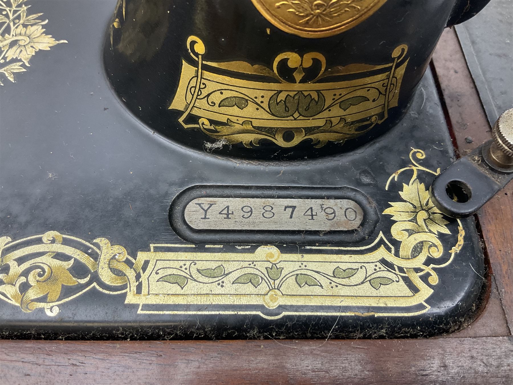 Cased early 20th century Singer hand sewing machine, lacking key