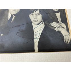 1960s autographed photographic postcard of The Rolling Stones showing Mick Jagger, Brian Jones, Keith Richard, Bill Wyman and Charlie Watts; signed in ink by all five members 13 x 9cm in modern mount and frame; together with a programme for the performance where the signatures were obtained supporting The Everly Brothers presumably at The Doncaster Gaumont as the date of this venue is hand written on the inside.