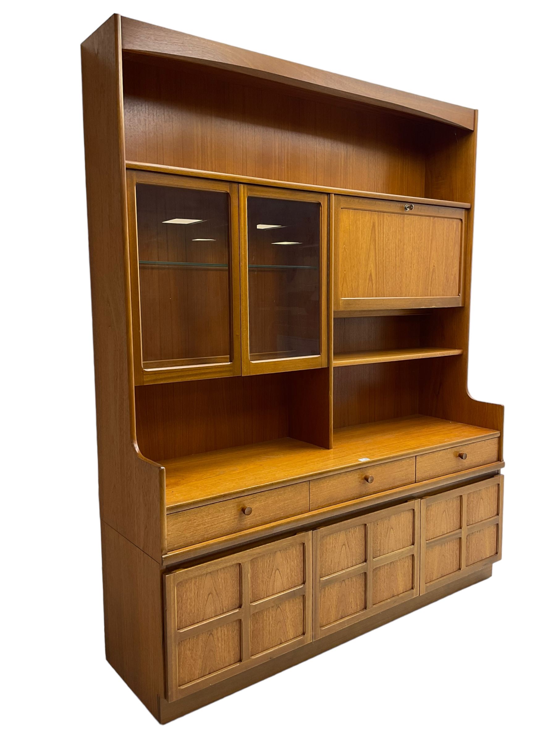 Nathan - teak wall unit, fitted with raised display cabinet and fall front compartment, three drawers and three cupboards below