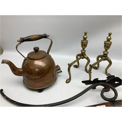 Two wood and metal candle wall sconces with fleur-de-lis mount, pair of brass fire dogs, brass paraffin blow torch converted to electric lamp, and brass kettle