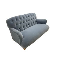 Tetrad - two seat sofa upholstered in baby blue buttoned fabric, on turned light beech front feet 
