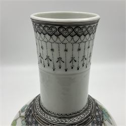 Pair of Chinese Republic porcelain vases, each painted in Famille Rose enamels with pairs of pigeons amidst peony, rock, flowering plants and leafy branches, possibly Qianlong seal beneath, H22cm 