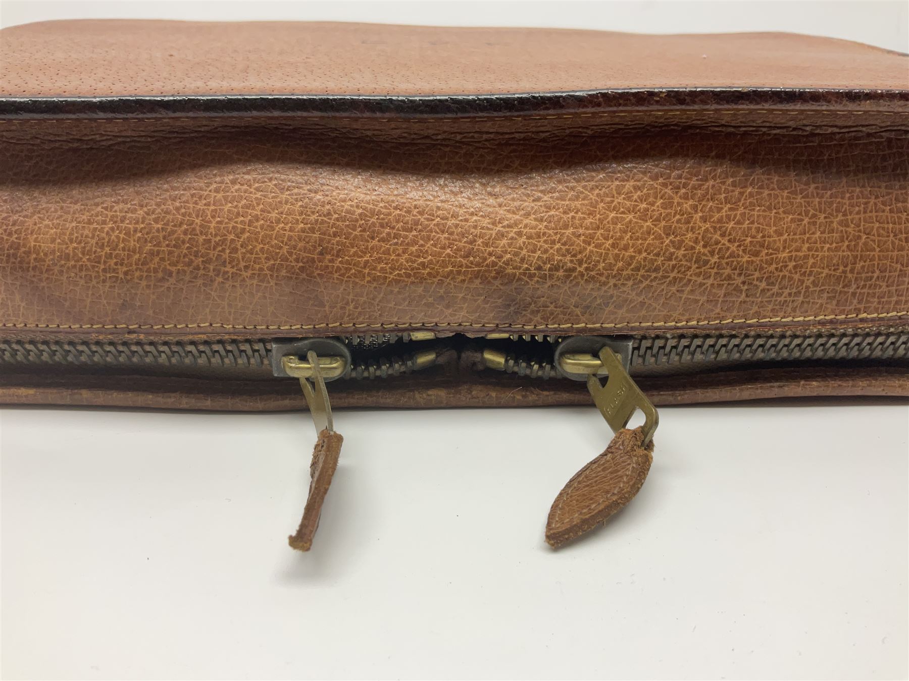 Mappin & Webb leather cased campaign gentleman's vanity set, the tan leather case opening to reveal fitted interior with five engine turned silver capped glass vanity bottles, hallmarked Mappin & Webb, London 1944, brushes, mirror etc, monogram DPK to the top of the case