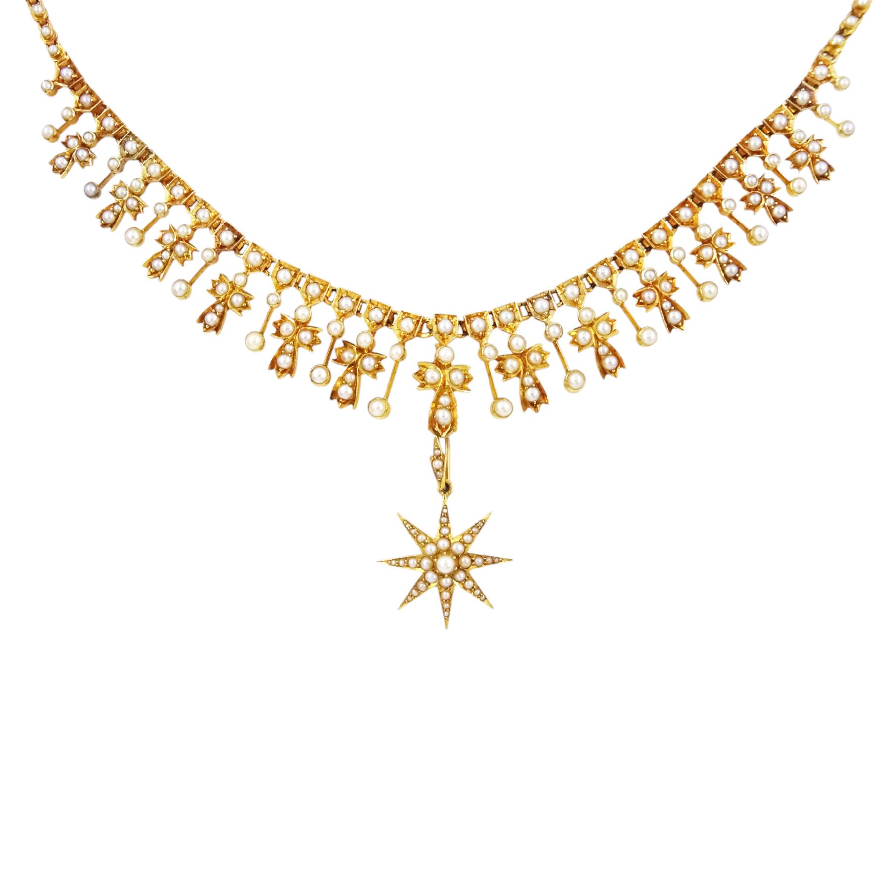Edwardian 15ct gold split pearl fringe necklace, thirteen graduating cross pendants, each spaced by pearl drops, the centre cross suspending an 18ct gold pearl star pendant, to a pearl set chain necklace, in silk and velvet lined case by Elkington, Glasgow