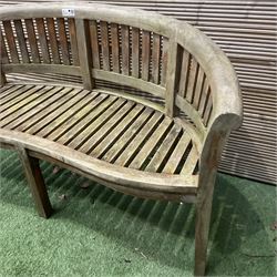 Teak serpentine curved garden bench - THIS LOT IS TO BE COLLECTED BY APPOINTMENT FROM DUGGLEBY STORAGE, GREAT HILL, EASTFIELD, SCARBOROUGH, YO11 3TX