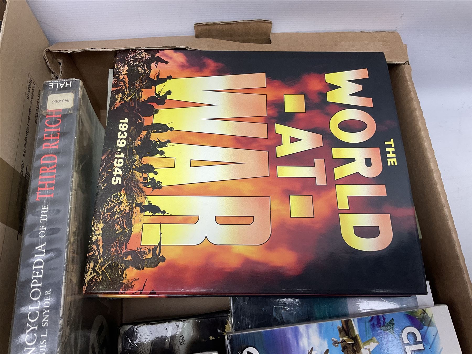 Three boxes of books, periodicals and DVDs of military interest with particular emphasis on WW2 including The History of World War Two in thirty original parts by Orbis, The D-Day Experience by Richard Holmes, The World War Two Databook, The World at War, Special Forces etc