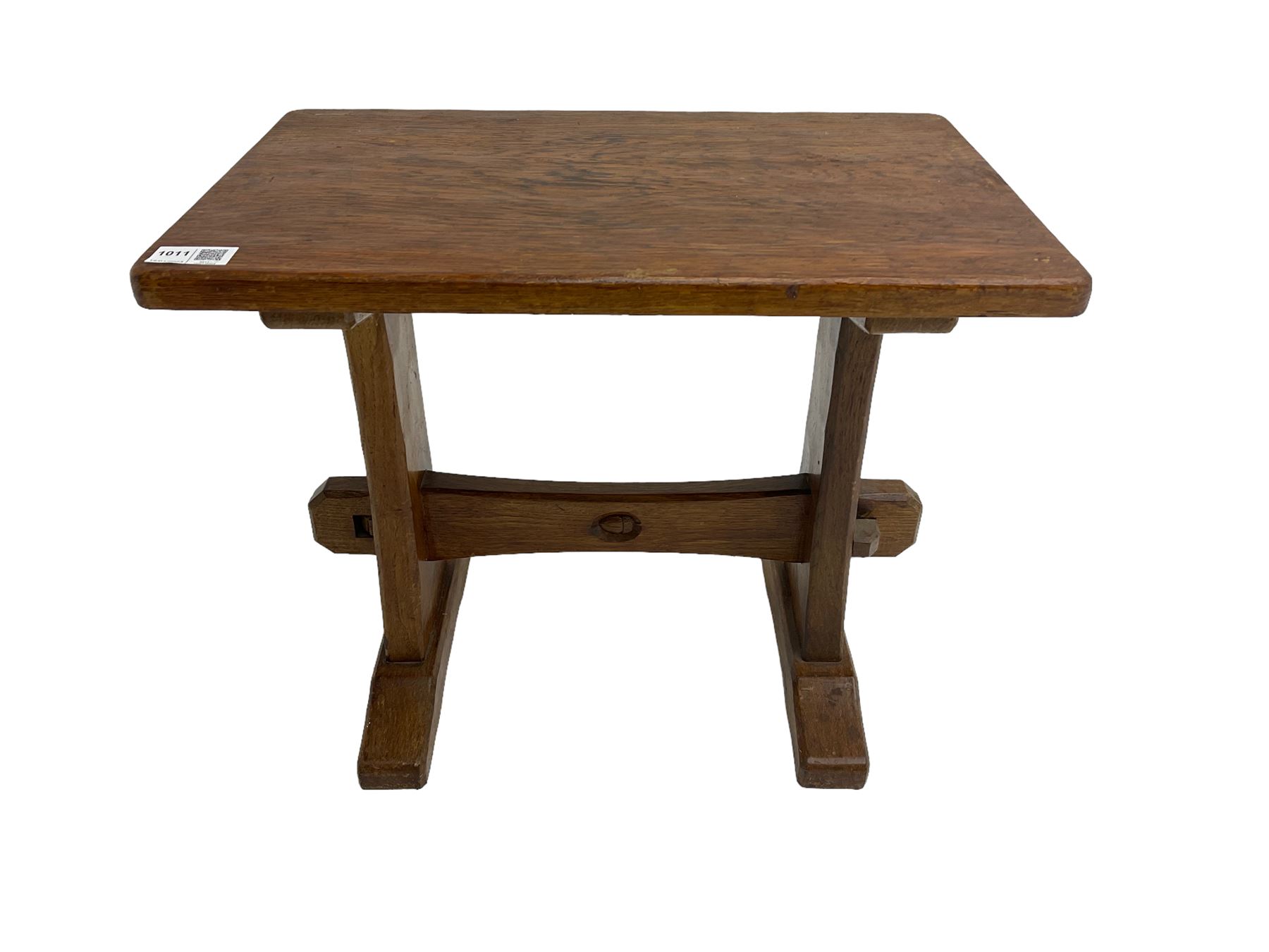 Acornman - oak occasional or side table, rectangular adzed top on shaped end supports joined by pegged stretcher on sledge feet, by Alan Grainger of Brandsby