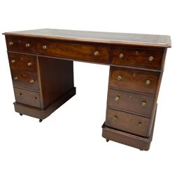 Victorian mahogany twin pedestal desk, rectangular top with inset ebonised leather writing surface, fitted with nine graduating drawers with brass pull handles, on plinth bases