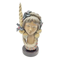 Lladro figure, Holiday Glow, modelled as a bust donning headpiece of holly, baubles and candles, on mahogany base, limited edition 168/1500, sculpted by José Puche, with original box, no 2249, year issued 1993, year retired 1997, with framed warranty of authenticity and letters, H30cm