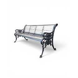 Victorian Andrew McLaren pattern cast iron bench, the ornate ends with detailed scrollwork, joined together with a cast iron seat and backrest frame supporting gently weathered oak slats, Victorian diamond stamp mark