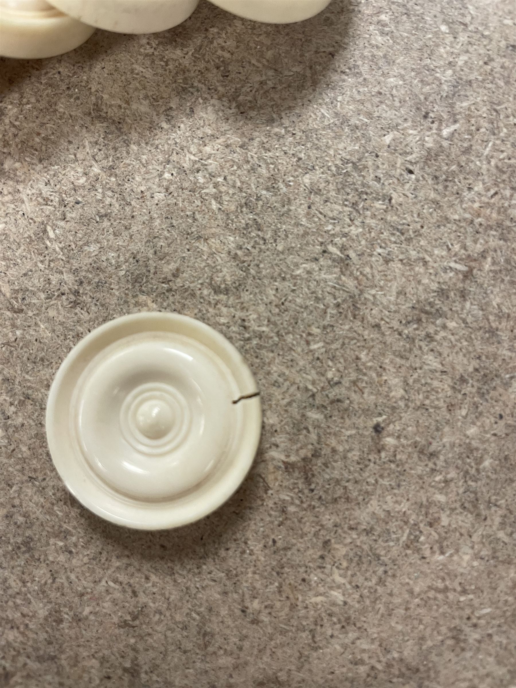 19th century walnut and brass bound games compendium box, painted to enhance the grain, of rectangular form, the hinged opening cover with rounded sides, central brass cartouche with engraved lion crest, and brass riveted straps, opening to reveal a red leather and blue silk lined compartmented interior, with fold-down games board, and lift-out tray containing playing cards, ebony turned dice towers, white and red stained bone draughts, and chess pieces, ivory dice, and ivory and ebony whist markers, and brass bezique board, cribbage board and markers, H15cm W32cm D24cm
This lot has been registered for sale under Section 10 of the APHA Ivory Act