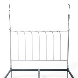And So To Bed - 'Squigalina' silvered metal framed 5ft king size four poster bed, the tubular chrome posters in scrolling foliate form, over a shaped and scroll-topped metal spindle headboard and footboard