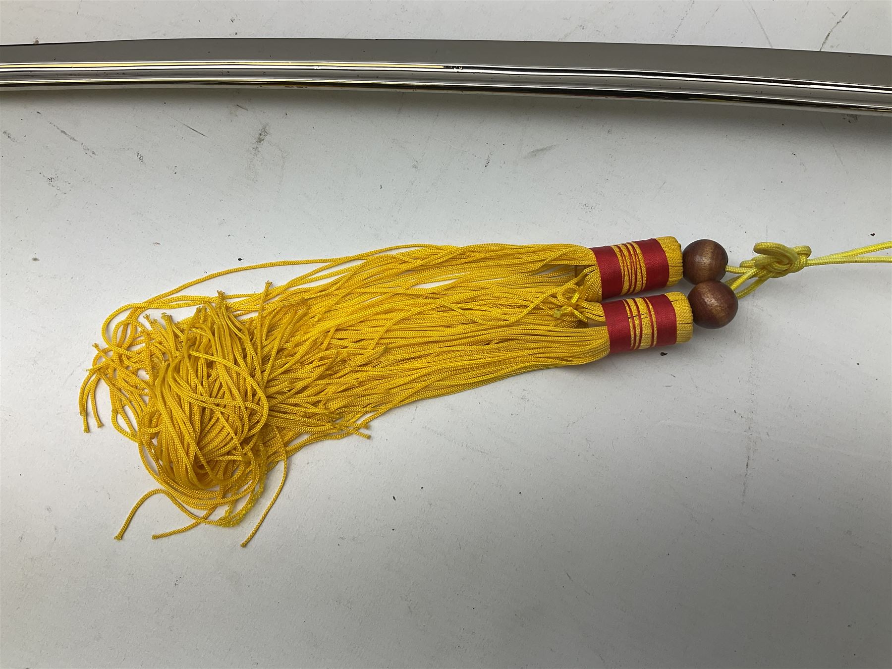 Three reproduction swords - Japanese katana and saya; Tai Chi sword with ornate scabbard; and dress sword with fullered triangular blade and horn handle (3)