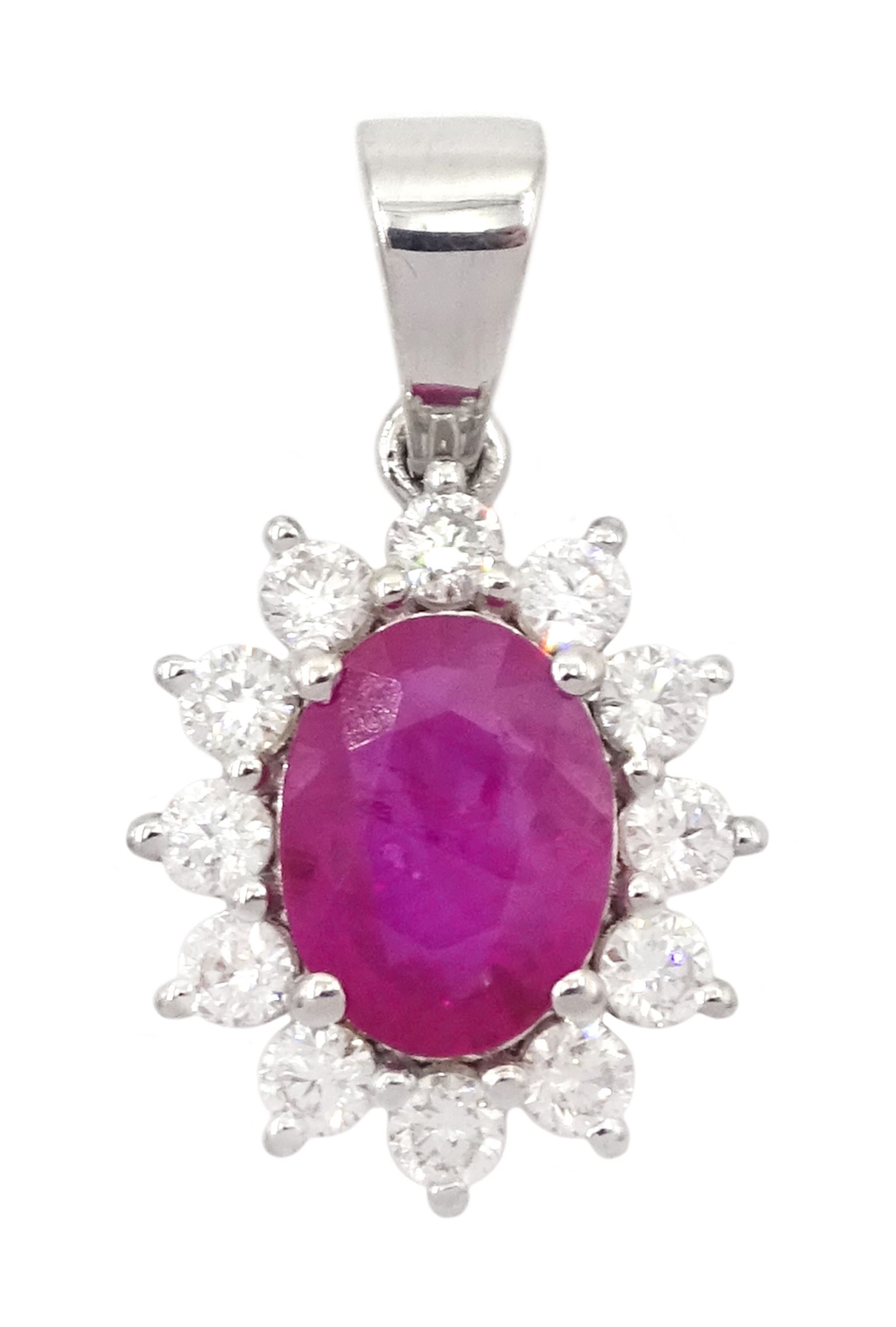 18ct white gold ruby and diamond pendant, single oval cut ruby of 1.15 carat surrounded by twelve round brilliant cut diamonds, stamped, total diamond weight approx 0.40 carat