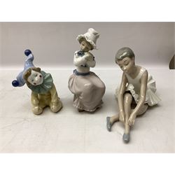 Collection of Nao figures, to include large figure of a walking lady carring a small dog and hat, H33cm, with box, together with seated young girl with dog, ballerina, clown, etc, all with printed marks beneath (9)