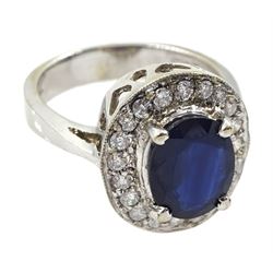 White gold oval sapphire and diamond cluster ring, stamped 14K, sapphire approx 2.00 carat