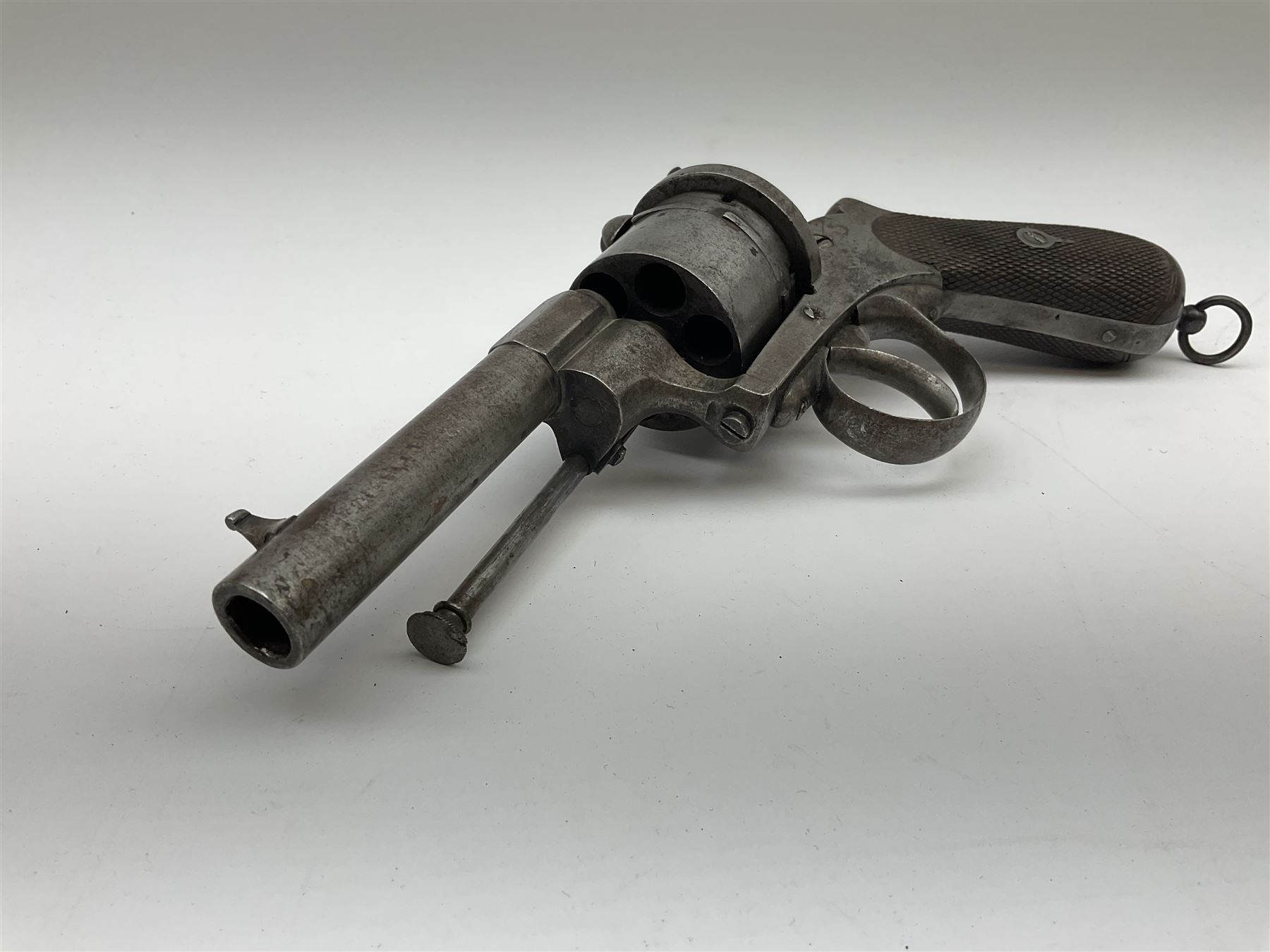 Mid-19th century 12mm (approx. .45cal.) six-shot pin fire revolver with single and double action, bears English proof marks, rifled barrel, fitted ejector rod and chequered walnut split grips L25cm