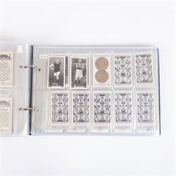 Collection of Edwardian and later Football related trading and cigarette cards, including forty-nine of fifty 1906 Ogden's Football Club Colours, 1922 PALS Footall series, ninety of one hundred 1925 Gallaher Famous Footballers, complete set of forty-four 1926 Ogden's Captains of Association Football Clubs and Colours, complete set of fifty 1927 Players Football Caricatures by MAC,  complete set of fifty 1927 Players Football Caricatures by RIP,  complete set of fifty 1930 Players Association Cup Winners, complete set of 50 1933 Ogdens AFC Nicknames etc, housed in brown cigarette card album