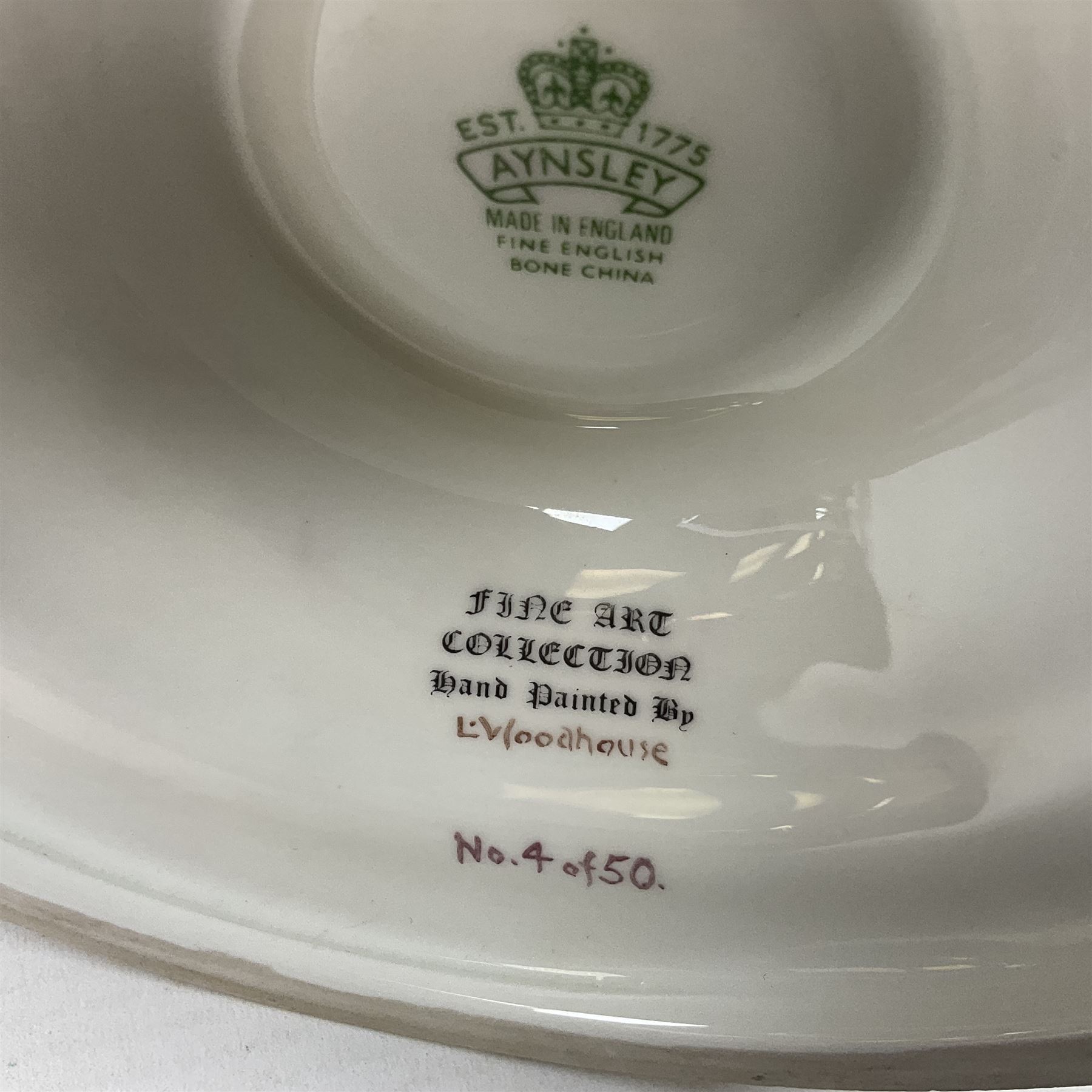 Aynsley twin handled racing cup and cover, to commemorate 'The Golden Jubilee of the Revival of The Yorkshire Cup', the handles inscribed '1927' and '1977', the green body painted by E. Woodhouse with Joe Childs up on Trimdon, the reverse with the winners, the domed cover with a Yorkshire rose finial, limited edition no. 4 of 50, on hexagonal wooden base with certificate, H34cm