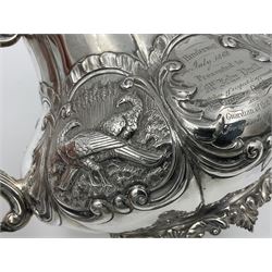 Victorian silver three piece tea service, comprising teapot, twin handled open sucrier, and milk jug, each of bellied form with acanthus capped scroll handles, the sides embossed with alternating scroll edged vacant panels and panels containing a pair of birds, upon four palmette feet, the teapot with ivory insulators to handle, and bird finial to the hinged domed cover, hallmarked William Hunter & Son, London 1861, teapot H19cm, including handles sucrier H13.5cm, including handle milk jug H12cm

This item has been registered for sale under Section 10 of the APHA Ivory Act