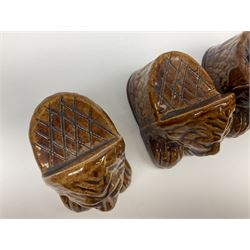 Set of four 19th century treacle glaze furniture/sash window rests modelled as lions, H9.5cm