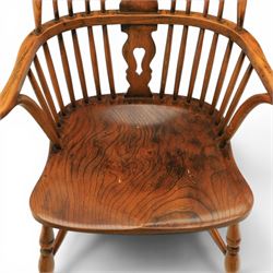 Pair of high back Windsor armchairs, fleur de lis back splat, dished seat, caroline stretcher
