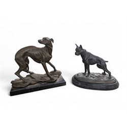 Two spelter dog figures, each upon hards