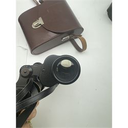 Four pairs of binoculars, to include Carl Zeiss Jena Jenoptem 8x30W serial no. 3750814, Nikon Sporting II 8x40 serial no. 604672, Minolta Pocket II 8x22 Field 7 and Jessops 12x25 Field 4.8 84m/1000m, all in carrying cases 
