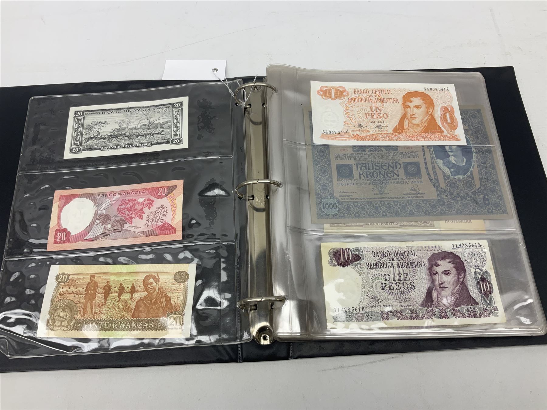 World banknotes, including Queen Elizabeth II The States of Jersey one pound 'DB202703', five pounds 'BB527762' and ten pounds 'AB651481', reserve bank of New Zealand two dollars '1L3 741894', King George V Straits Settlements one dollar 1st January 1935 'F/83 28924', various Bank of England notes etc, housed in two ring binder albums